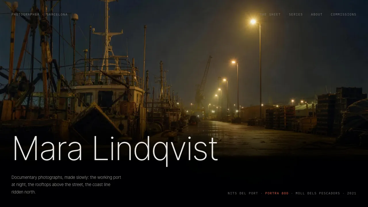 Website design — a dark photography portfolio, one full-bleed photograph of Barcelona's working port at night with the photographer's name across its dark lower edge